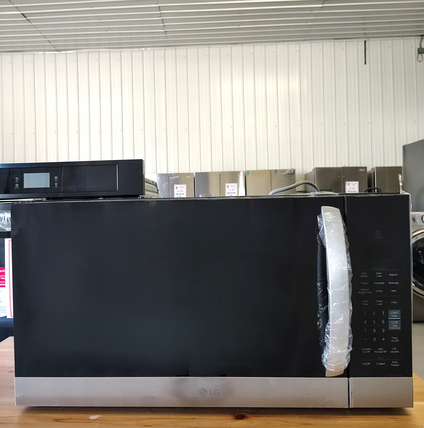 LG 1.7-cu ft Over-the-Range Microwave with Sensor Cooking MVEM1721F