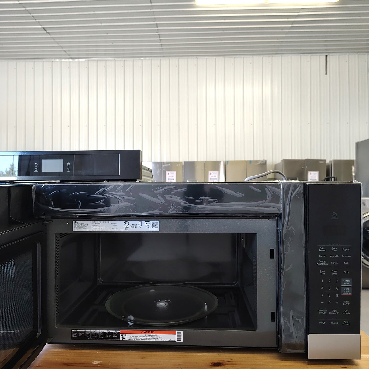 LG 1.7-cu ft Over-the-Range Microwave with Sensor Cooking MVEM1721F